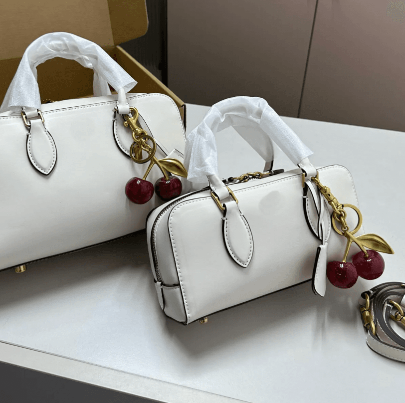 Coach with cherry keychain